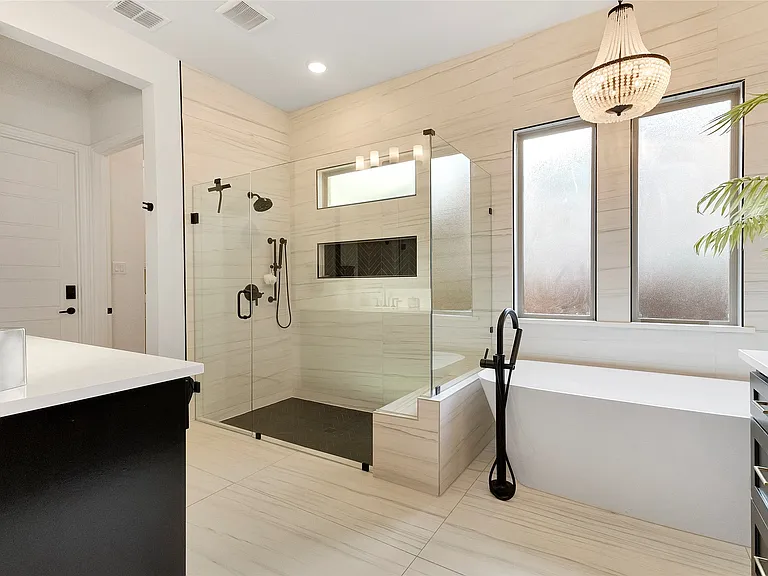 Spa Bath with Beaded Chandelier in Prosper, TX by SHADELE Design & Remodeling