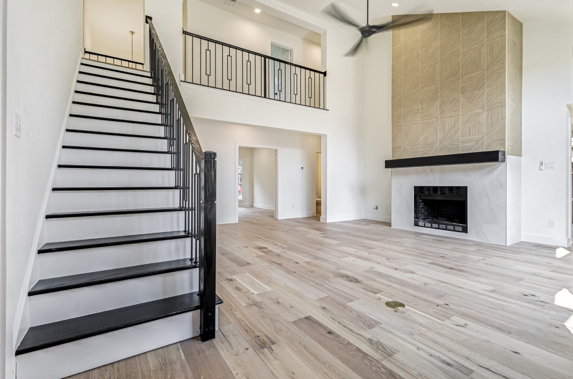 Vaulted Living with Fireplace in Prosper, TX by SHADELE Design & Remodeling