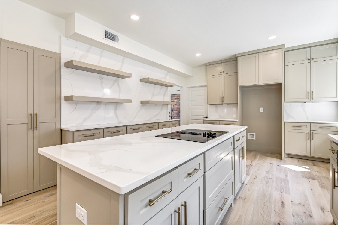 Oversized Island with Cooktop in McKinney, TX by SHADELE Design & Remodeling