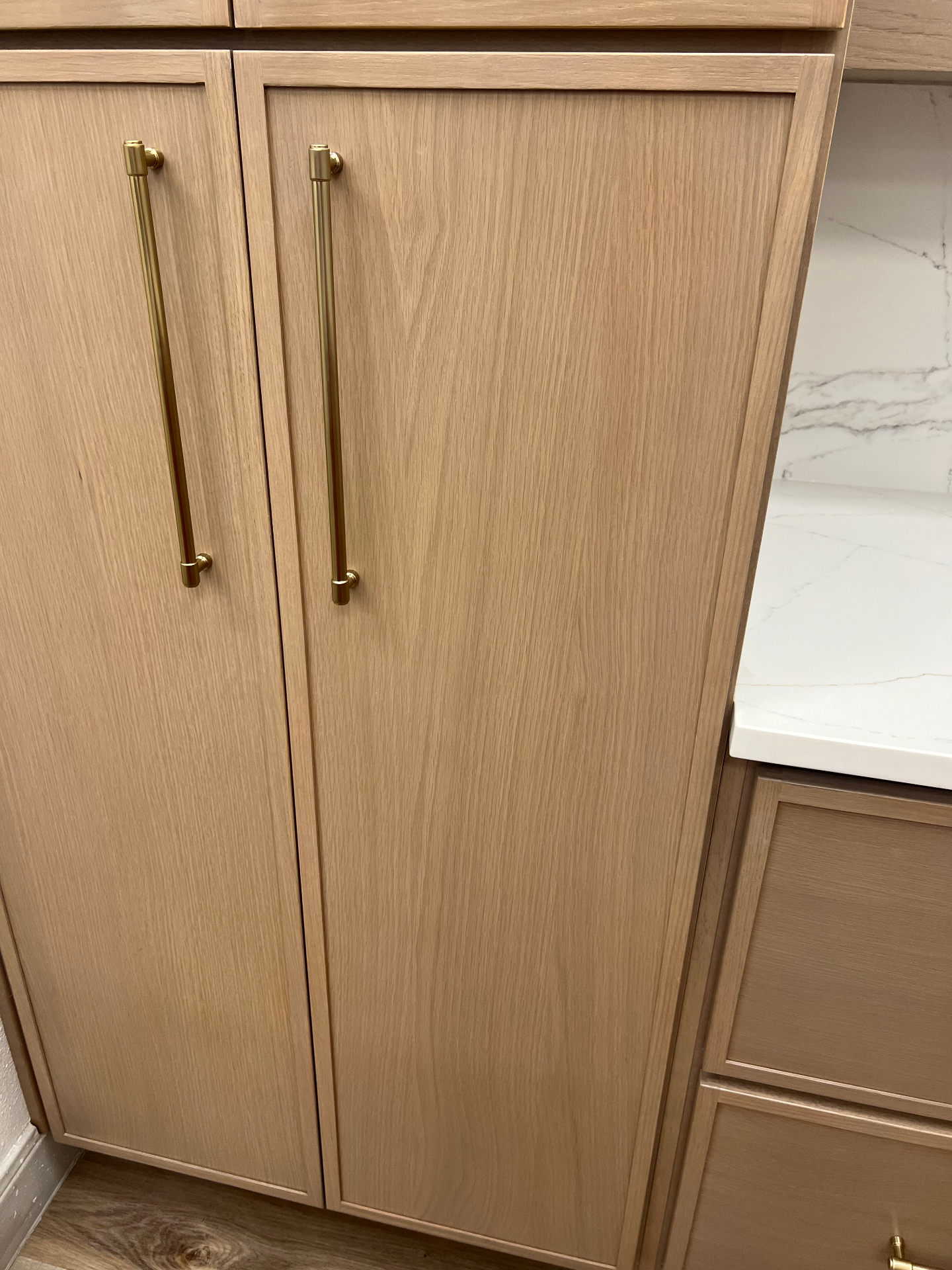 White Oak Pantry with Brass Pulls in Frisco, TX by SHADELE Design & Remodeling