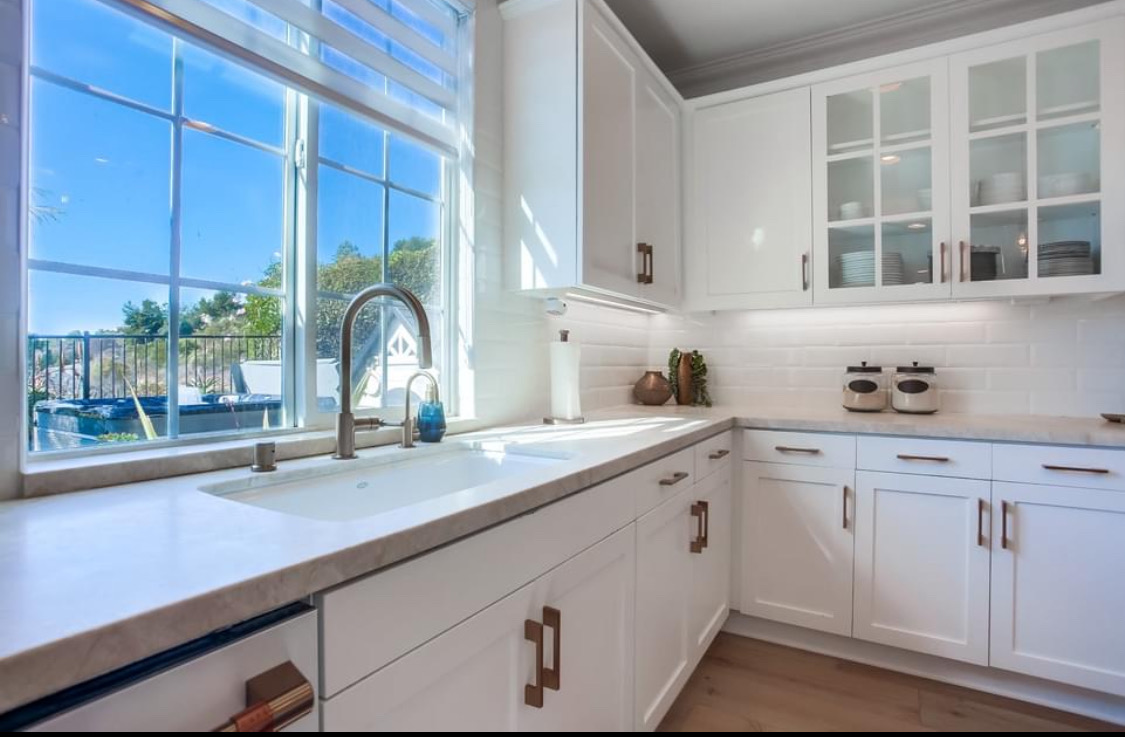 White Kitchen with Window Sink in Frisco, TX by SHADELE Design & Remodeling