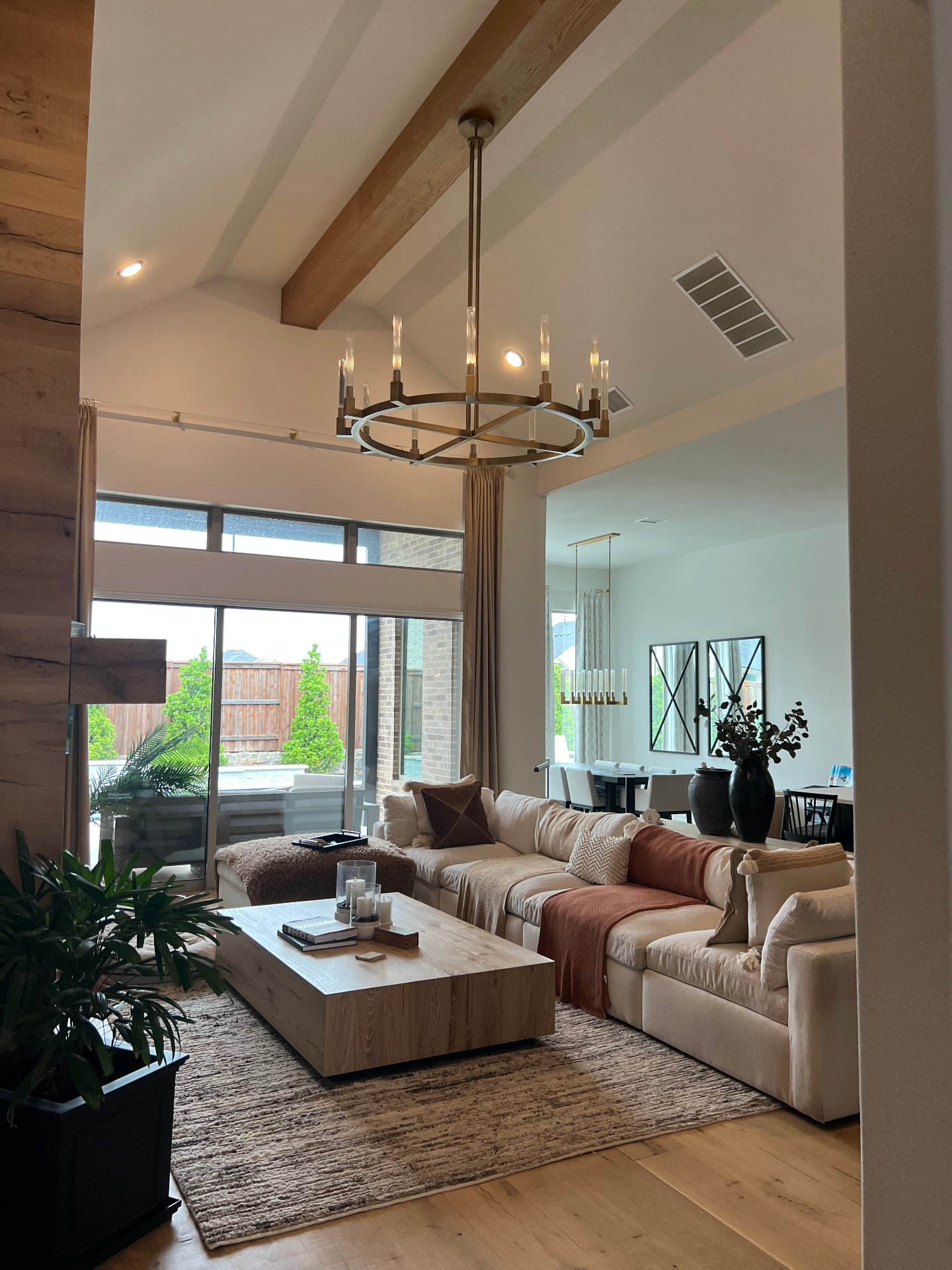Vaulted Living Room with Wood Beams in Prosper, TX by SHADELE Design & Remodeling